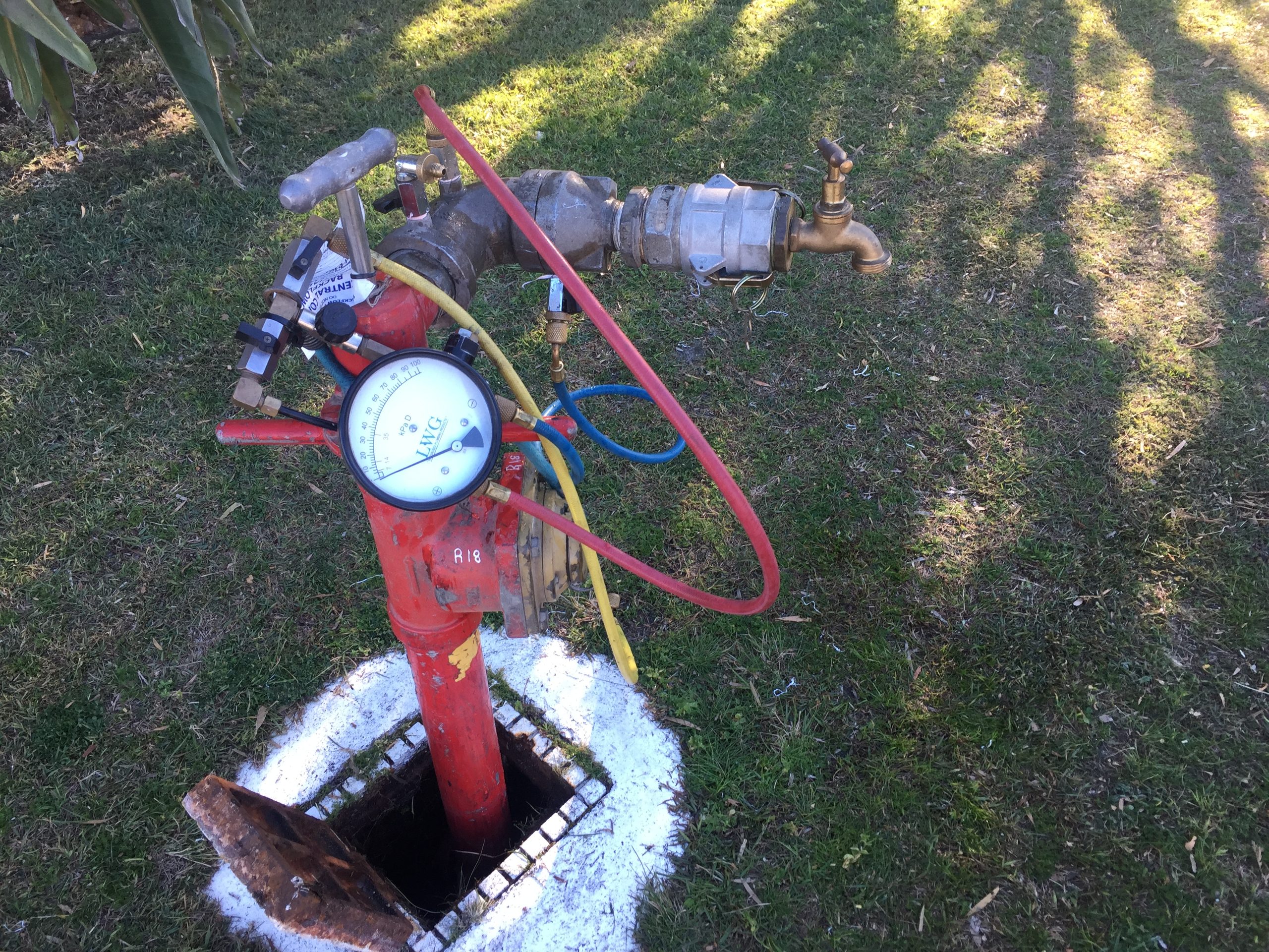 standpipe with a backflow device being tested